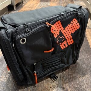 Stylish Spy Optic Inc. Black and Orange Bag/Backpack.